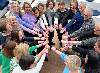 OpenText employees in a circle