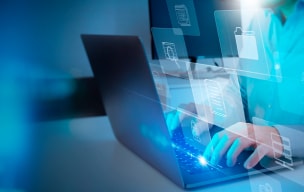 person typing on laptop