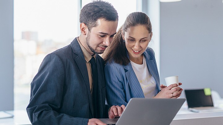two people looking at laptop