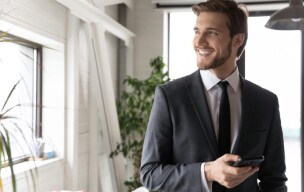 Low-angle view of modern glass skyscrapers against a clear sky