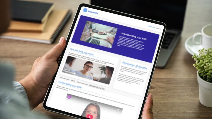 Person holding a tablet displaying a business website