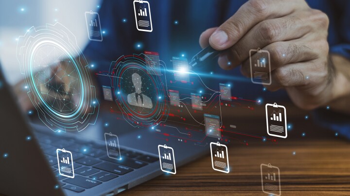 Person touching digital screen with pen