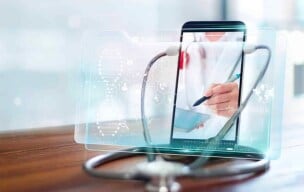 Smartphone screen displaying a doctor writing, with a stethoscope in the foreground.