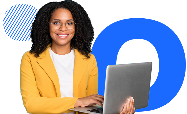 A person smilng and working on the computer