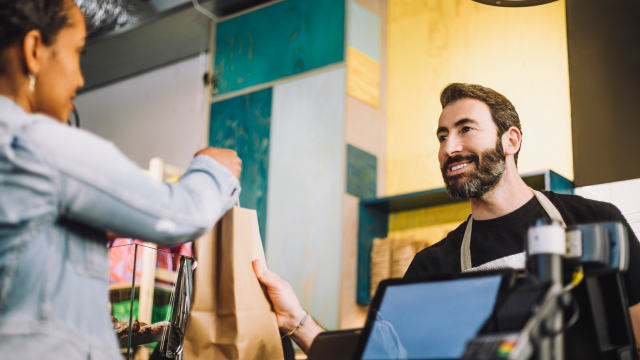 A man getting packing from bill counter