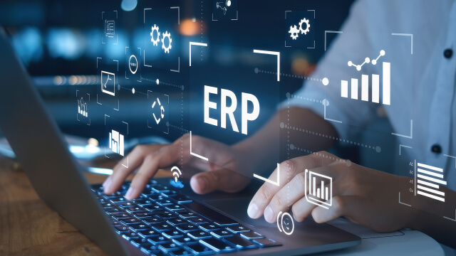 A person typing on a laptop