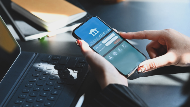 The person using mobile banking application on smartphone 