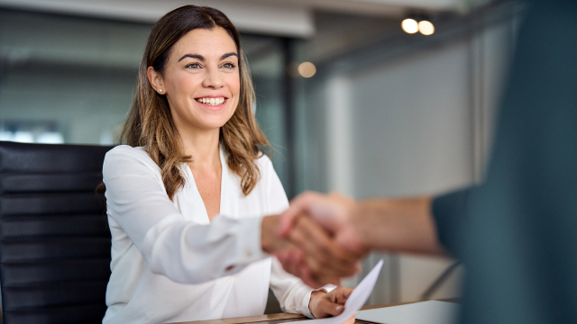 Business people shaking hands in a bank office