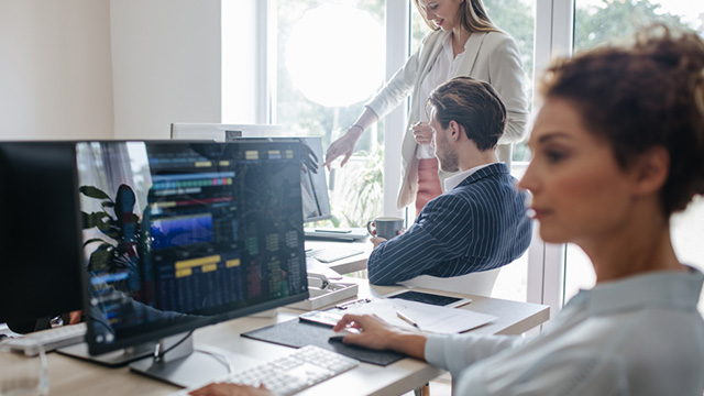 Women working at a computer.