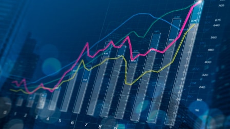 Digital business growth chart showing upward trending graphs and data analytics on blue background