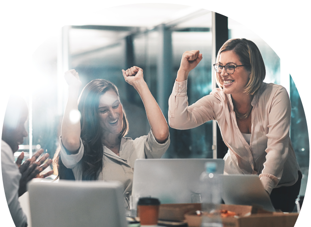 Happy business team celebrating success together in a modern office workspace